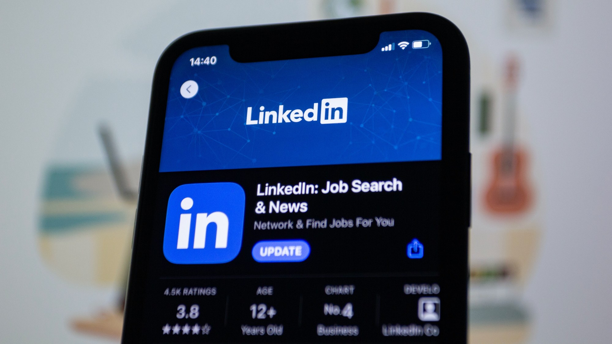 A cell phone with the app store open, showing the LinkedIn app.