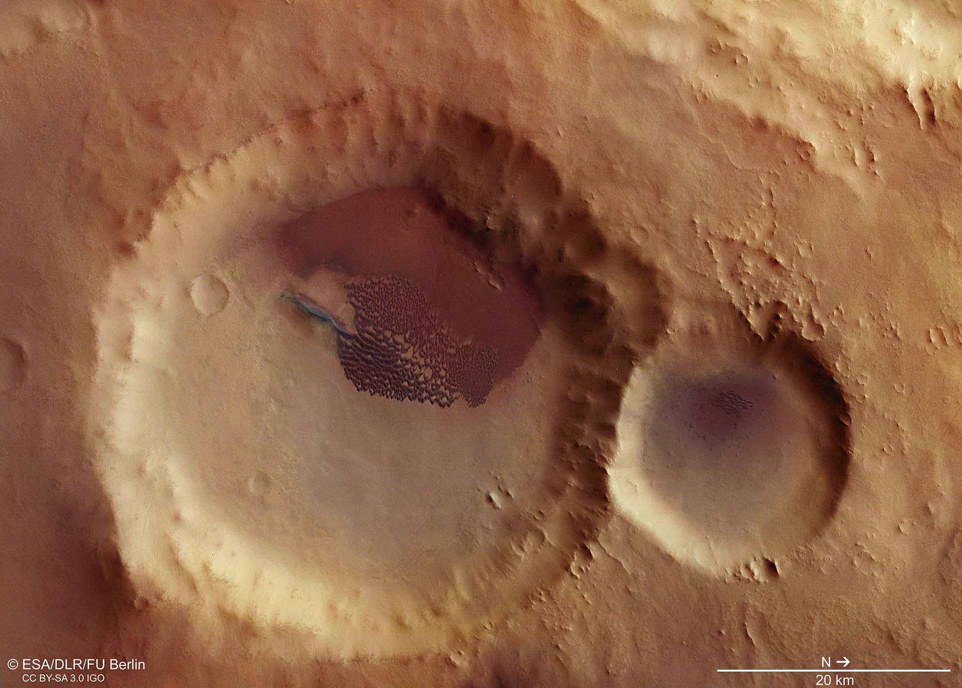 Crater with dune field close to the Aonia Tholus volcano