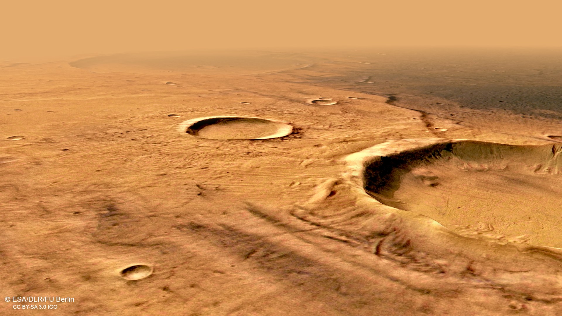 Perspective view of an old crater with dark colouration in Terra Cimmeria