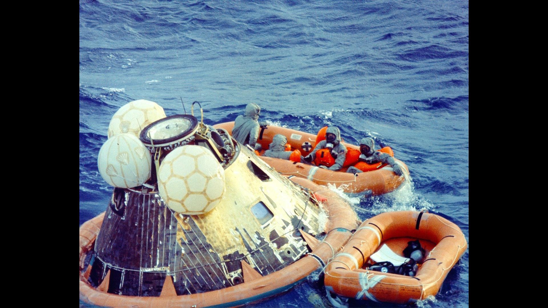 The Apollo 11 Command Module with the three astronauts on board splashed down in the western Pacific Ocean.