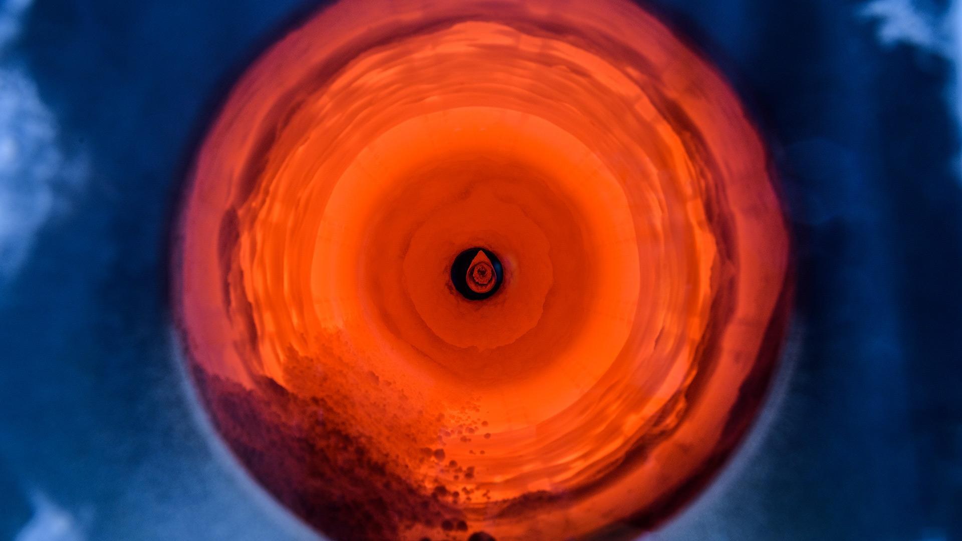 View of raw cement powder in the still-glowing rotary kiln.