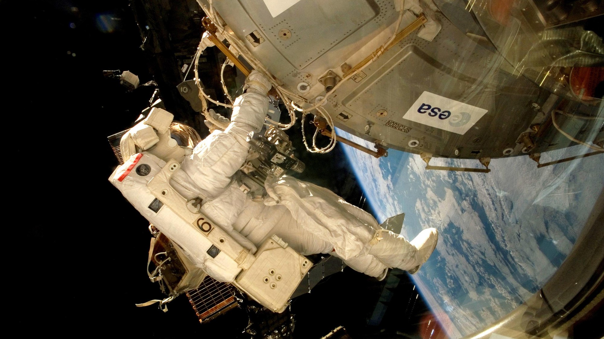 NASA astronaut Rex Walheim attaches Columbus to the ISS