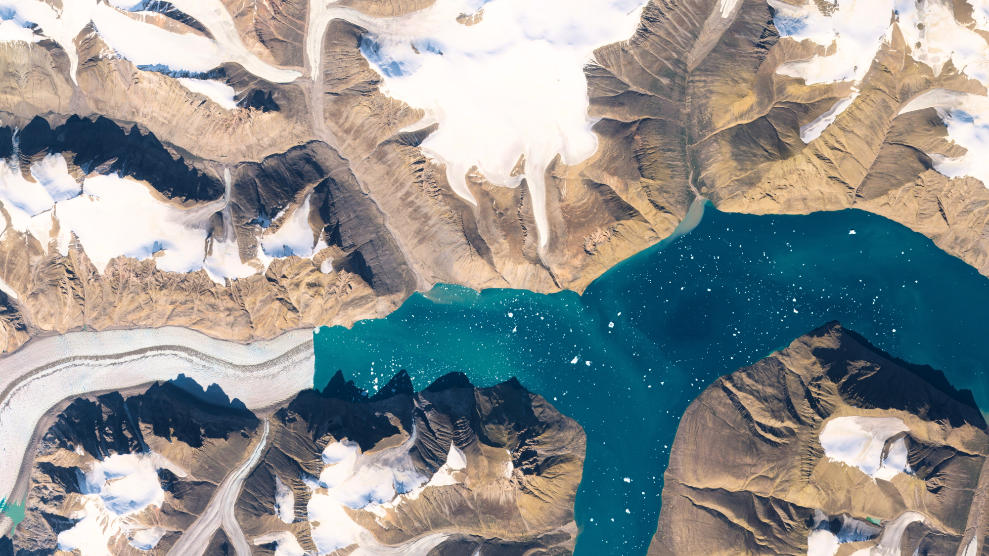 Snow and a calving glacier in Greenland