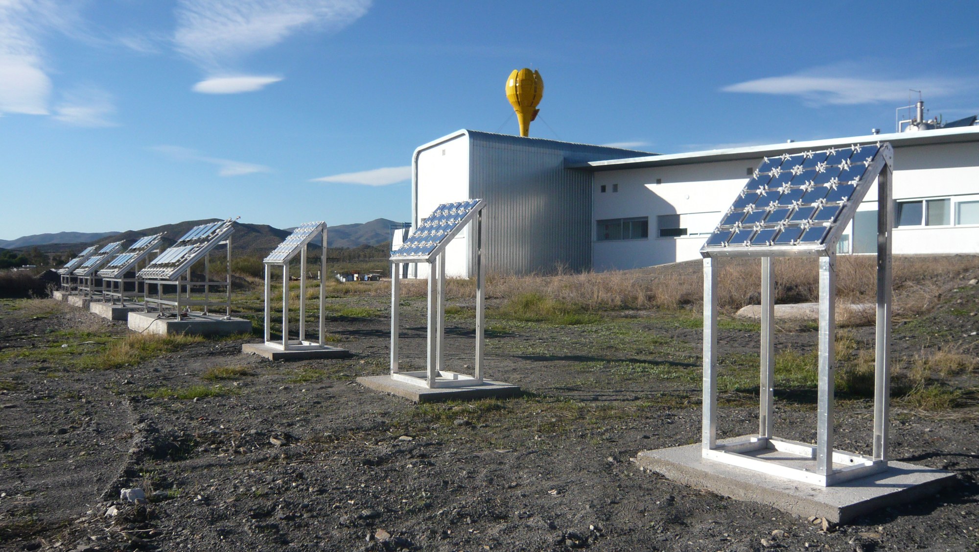 Outdoor exposure racks for material samples in front of the OPAC laboratory