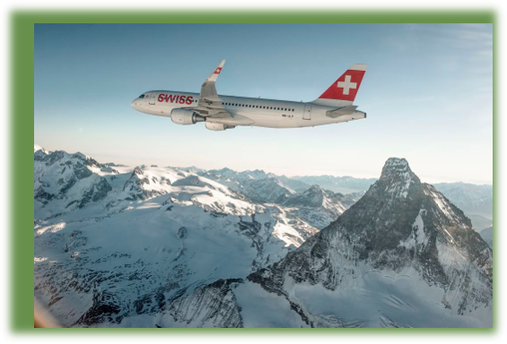 SWISS plane flying over snowy mountains