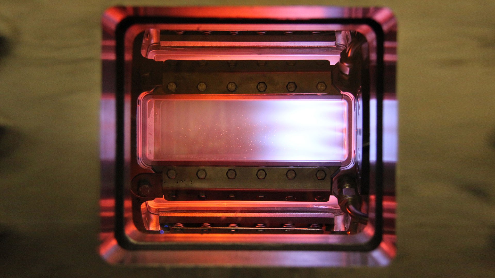 Photo of a flame in the high-pressure combustion chamber test rig